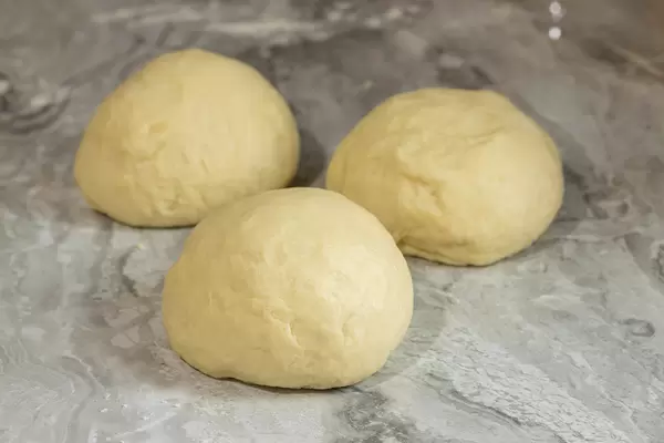 Raw Dough on the grey marble table