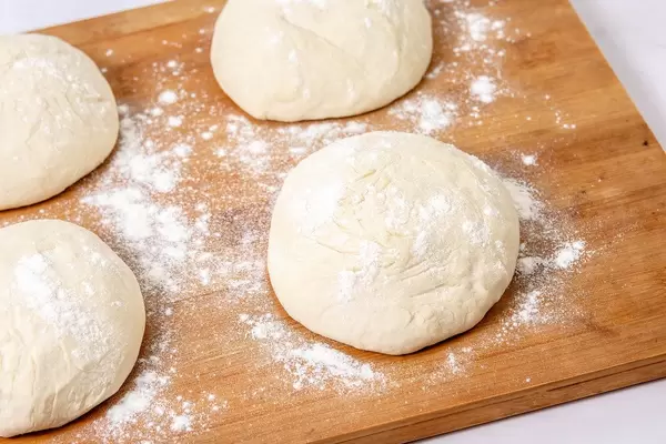 Raw Dough on the wooden board (Flip 2019)