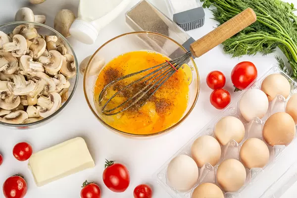 Raw ingredients for making an egg omelet