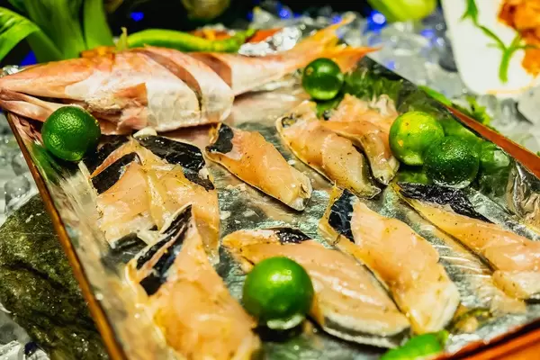 Raw milkfish on tray with calamansi