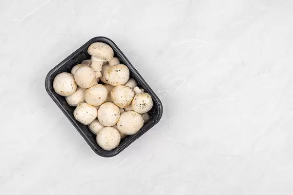 Raw Mushrooms on the table with copy space