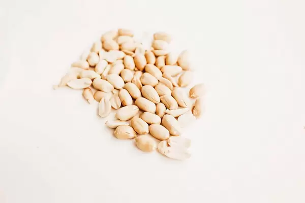 Raw peanuts on white background isolated