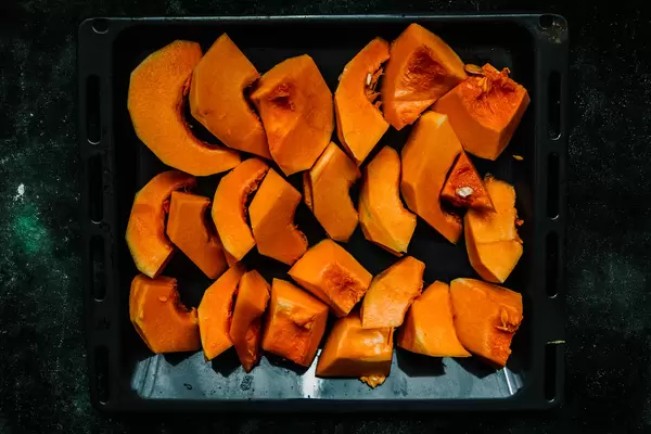 Raw Pumkin Slices On The Black Pan