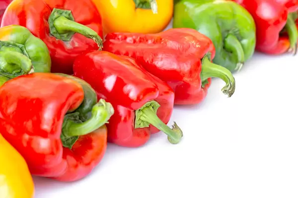 Raw ripe sweet peppers of different colors