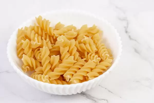 Raw uncooked Crispy Pasta in the bowl (Flip 2019)