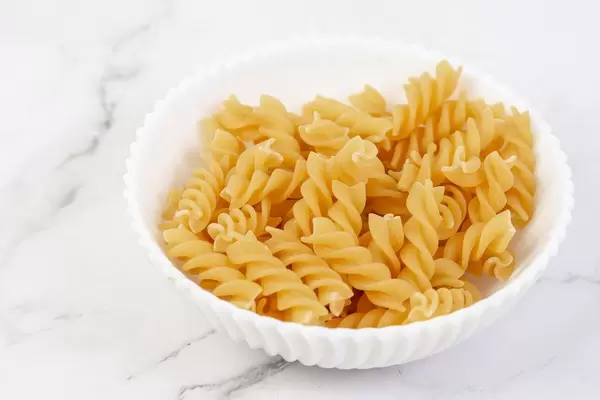 Raw uncooked Crispy Pasta in the bowl