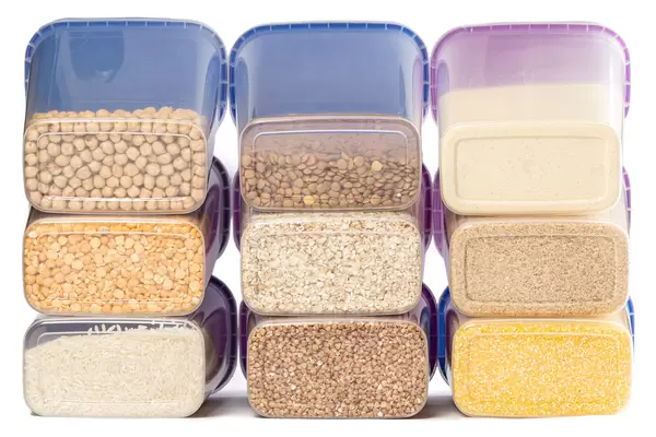 Raw various cereals in plastic containers