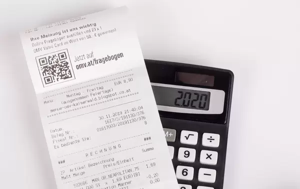 Receipt on black calculator