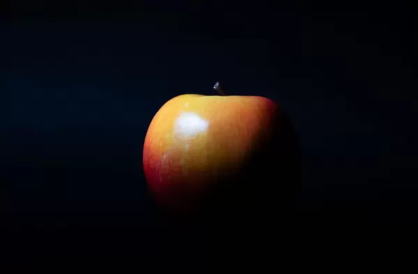 Red apple with black isolated background