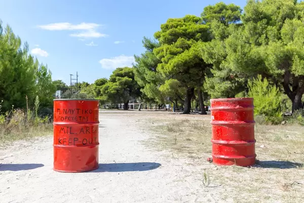Red barrels at the entrance to a military area