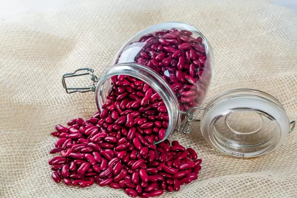 Red beans poured into burlap