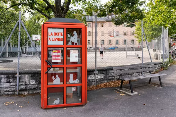Red bookcrossing booth at the city center of Sion