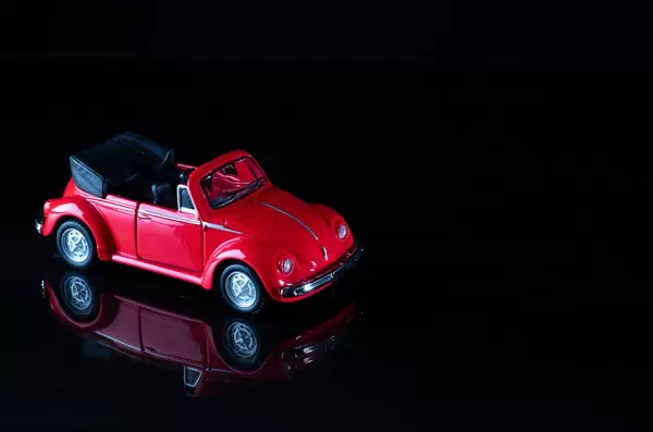 Red cabriolet car on black background (Flip 2019)
