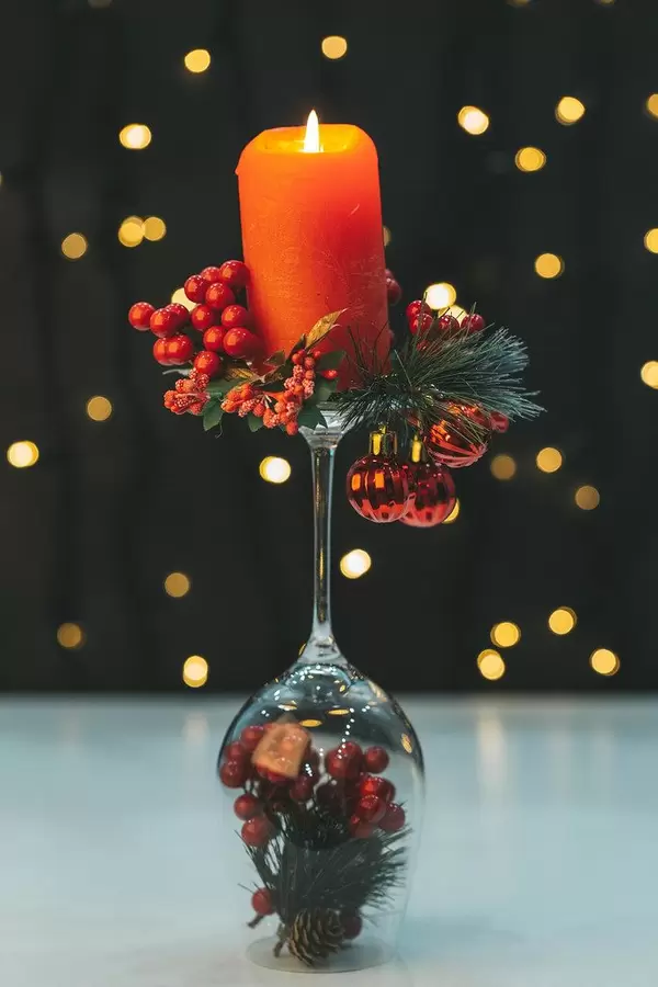 Red candle with candlestick on night background with bokeh (Flip 2019)