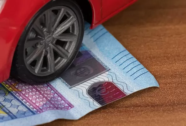 Red car over a money