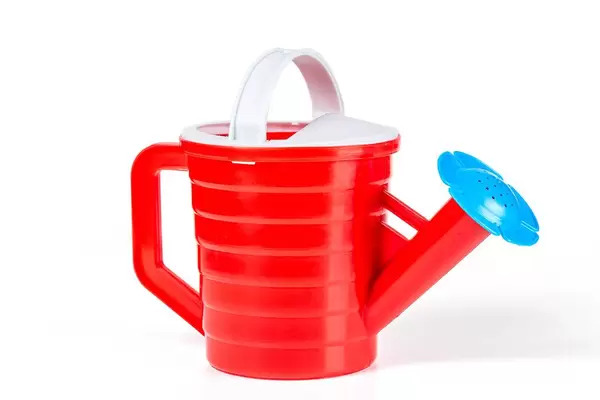 Red children's water dispenser on a white background