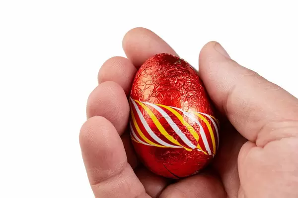 Red Chocolate Easter Egg in the hand (Flip 2019)
