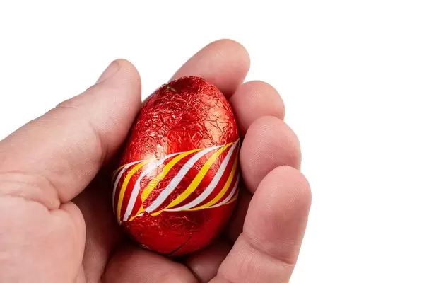 Red Chocolate Easter Egg in the hand