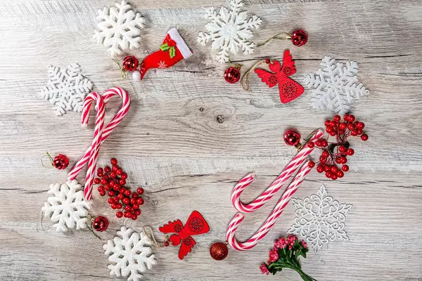 Red Christmas decor and white snowflakes on wooden background with free space (Flip 2019)