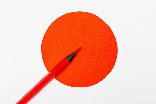 Red circle and red pencil-the concept of an important decision, attention (Flip 2019)