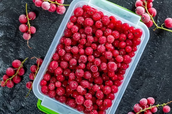 Red currant berries on black background (Flip 2019)
