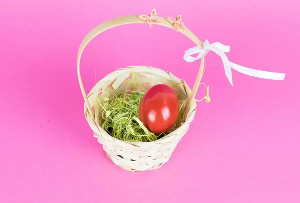 Red Easter egg in a basket
