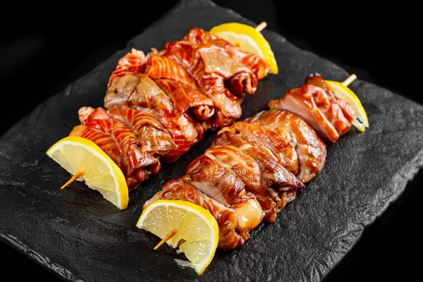 Red fish fried kebab with lemon