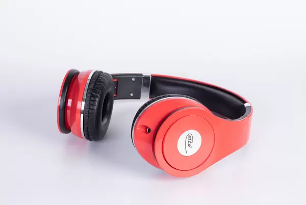 Red headphones on a white background