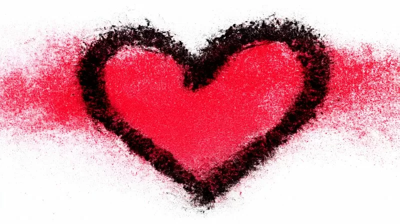 Red heart drawn with lipstick on white surface