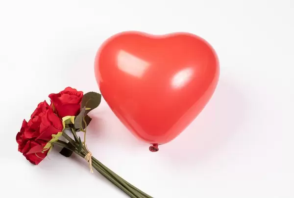 Red heart shaped balloon with flowers