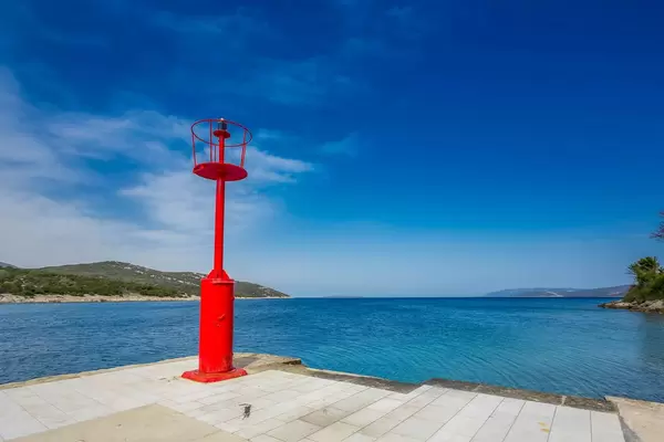 Red lighthouse on island Cres, Croatia