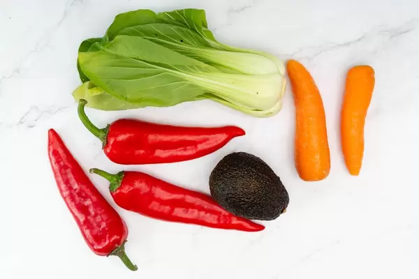 Red Paprika Bok Choy Avocado and Carrots on the white background