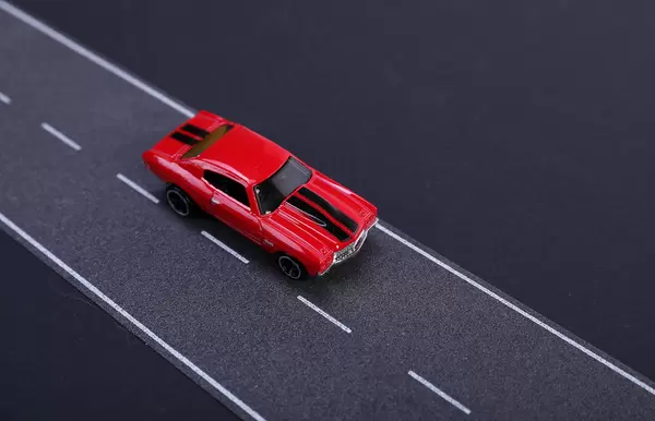 Red racing car on the road