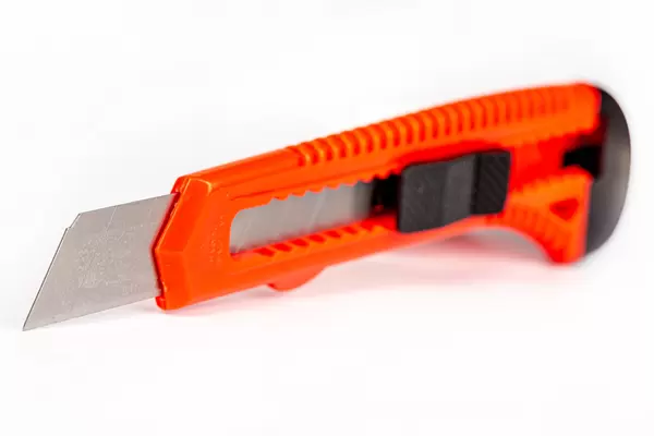 Red sharp knife stationery, white background