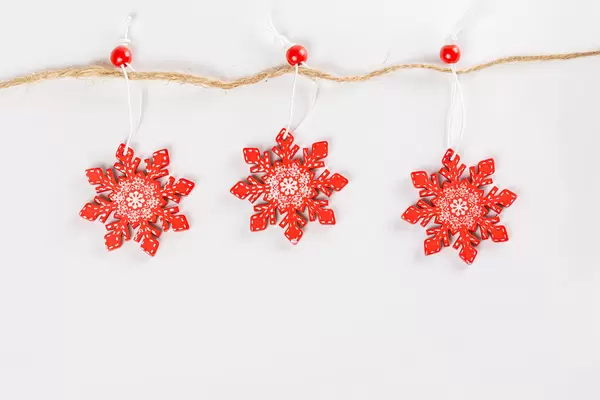 Red snowflakes christmas decor on a rope