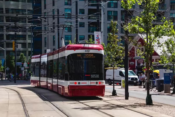 Red Tramway with building in a background