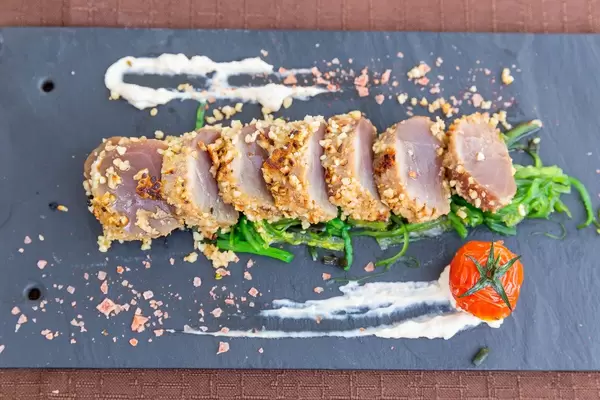 Red tuna in almond crust, prepared according to Japanese method Tataki. Restaurant Q11, Pollença