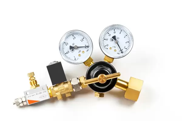 Reducer for a carbon dioxide cylinder on a white background (Flip 2020)