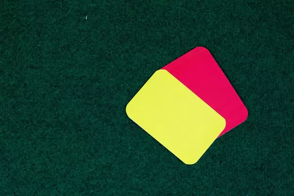 Referee cards on grass background