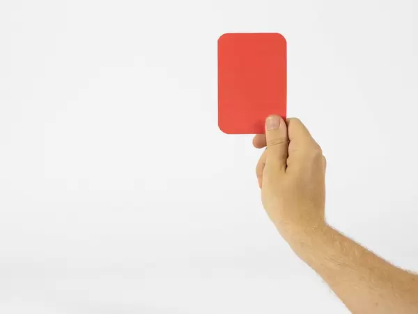 Referee showing a red card