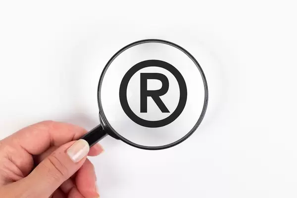 Registered trademark symbol under magnifying glass