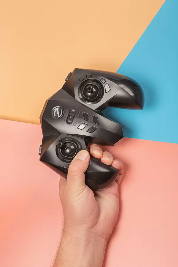 Remote control for playing in male hand, gamer concept