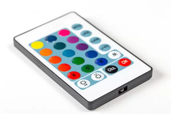 Remote control with multi-colored buttons on a white background (Flip 2019)