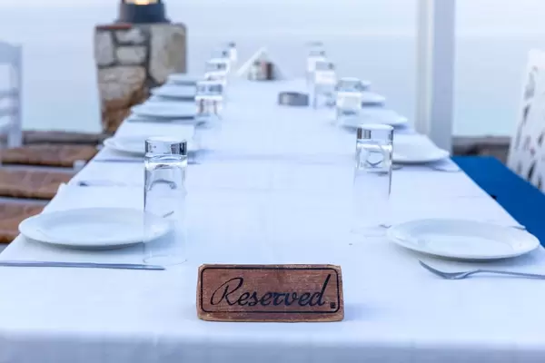 Reserved sign on a table in a Greek restaurant