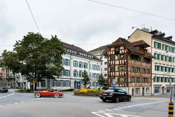 Retro car looking harmoniously in historic center of Lucerne, Switzerland