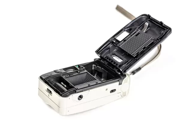 Retro film photo camera on white background