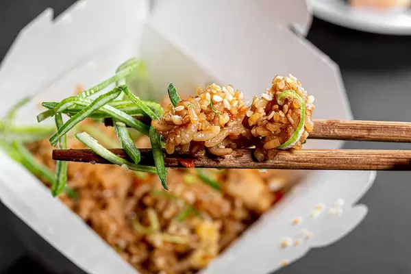 Rice with vegetables on chopsticks