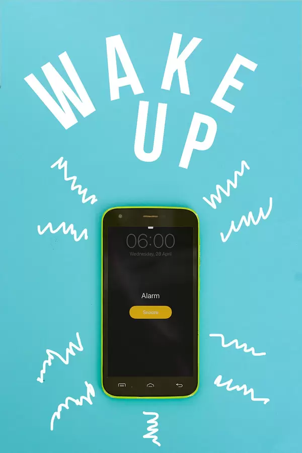 Ringing alarm clock on mobile phone with text - wake up