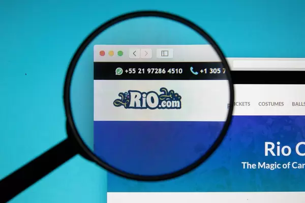 Rio Carnival logo on a computer screen under magnifying glass