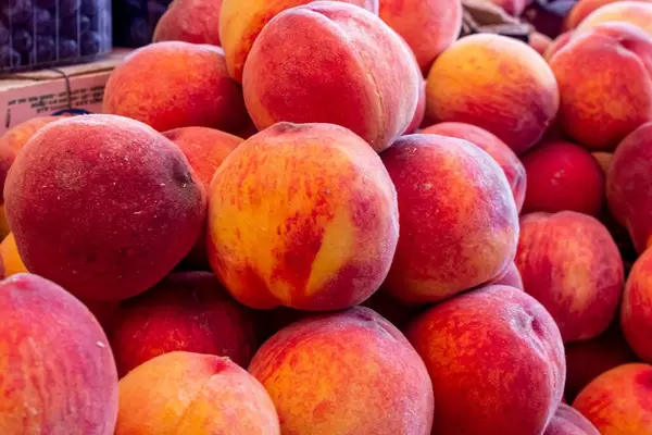 Ripe red-orange peaches background (Flip 2019)